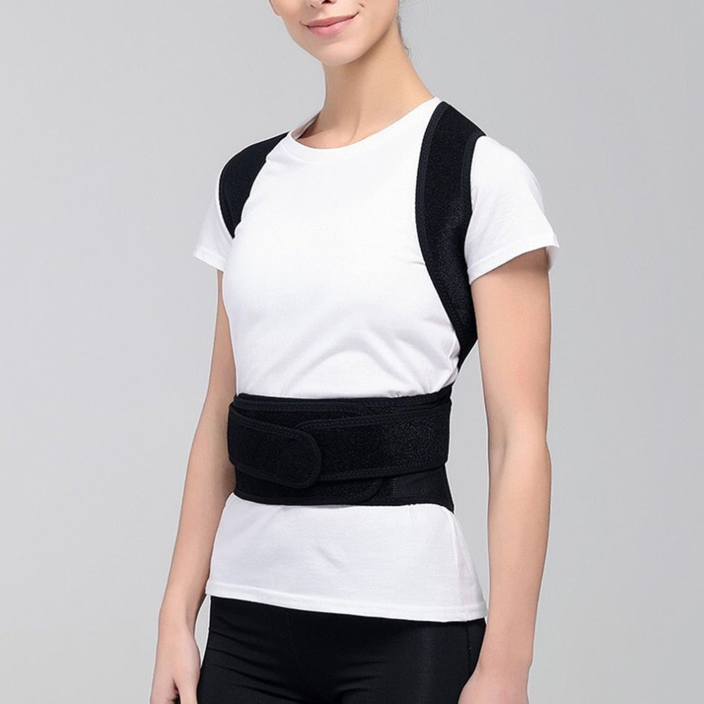Person wearing a black posture corrector for back and shoulder support